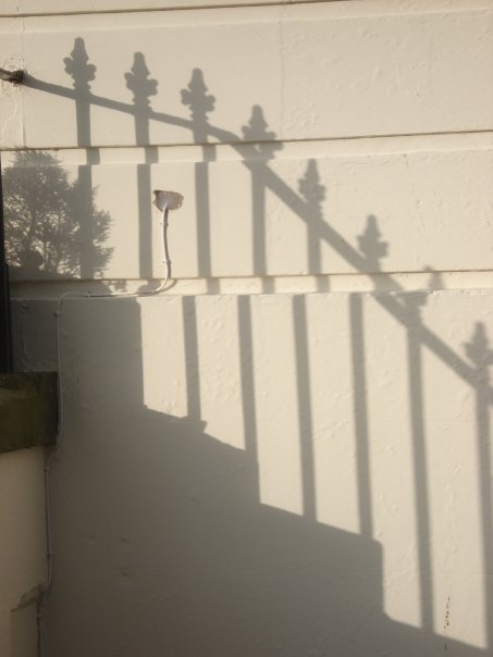 shadow of ironwork on The Crescent