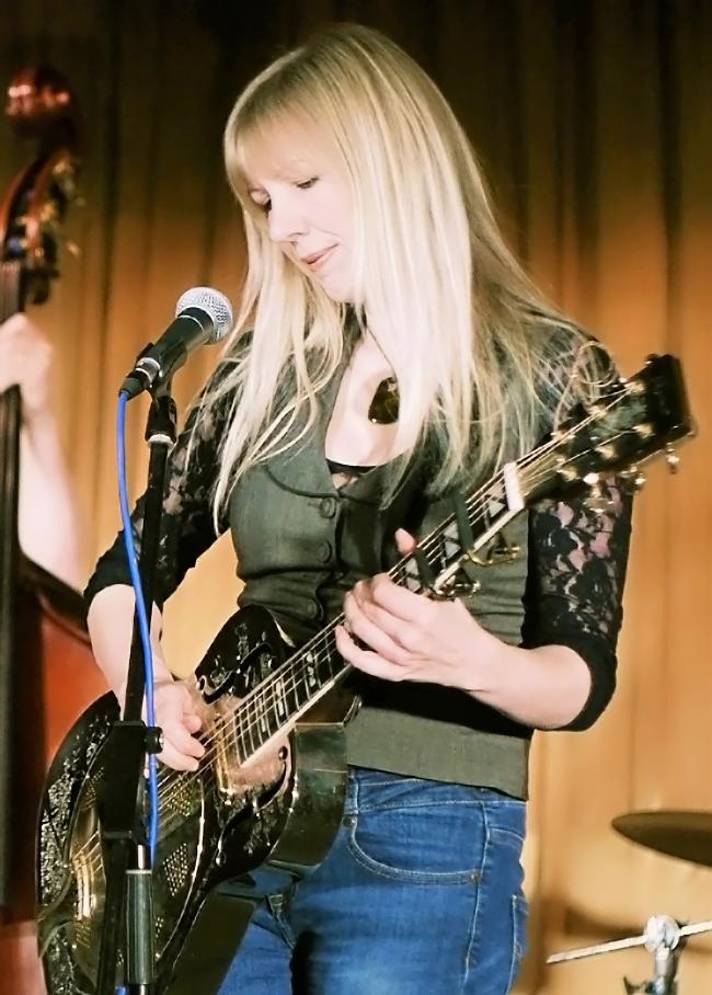 Becky Mills with guitar